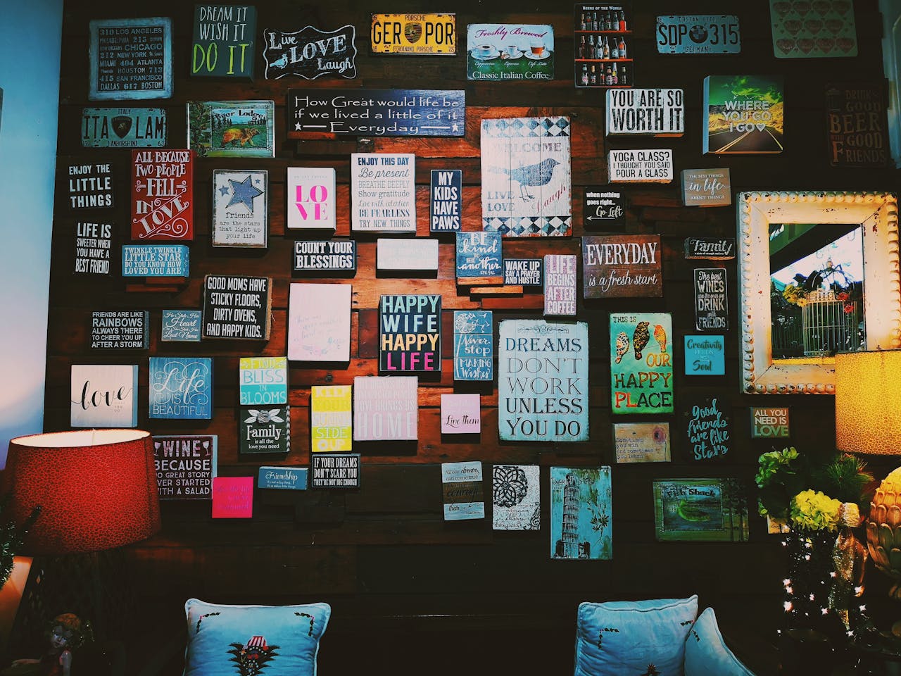 about-us A warm and inviting indoor space with motivational quotes displayed on a wooden wall.